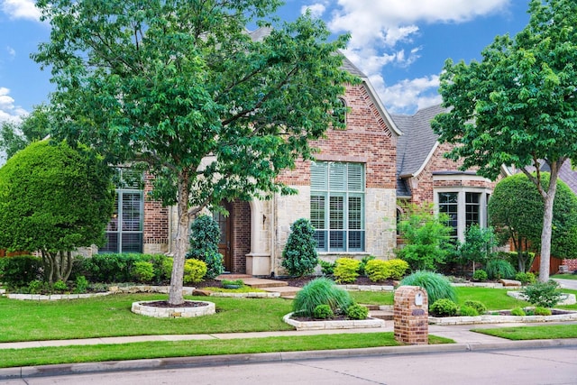 1727 Lantana Ln, Frisco, TX 75033 - view of front of property with brick siding, stone siding, and a front yard