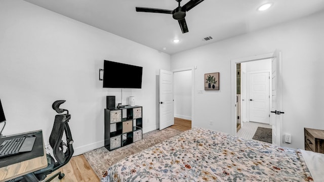bedroom with baseboards, wood finished floors, recessed lighting, an office area, and ceiling fan