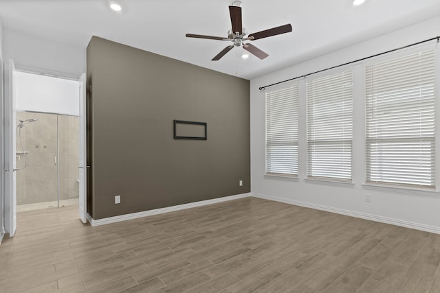 unfurnished room with a ceiling fan, baseboards, wood finished floors, and recessed lighting