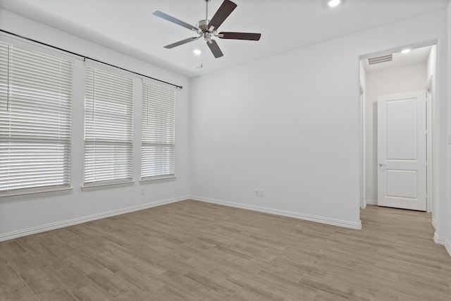 unfurnished room featuring a ceiling fan, light wood finished floors, baseboards, and recessed lighting