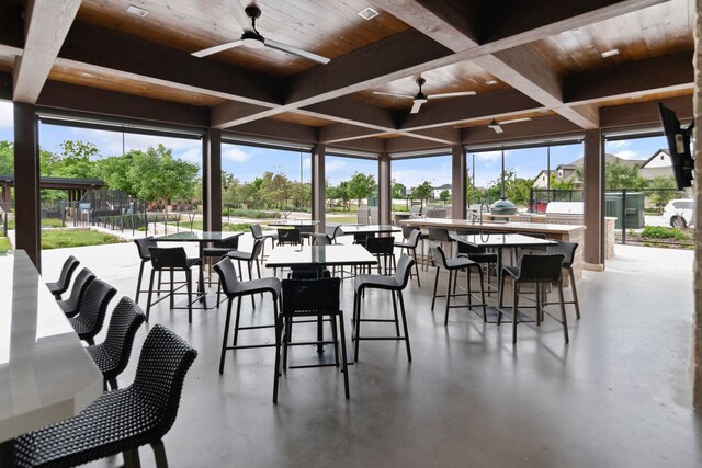 view of patio featuring a ceiling fan, fence, and area for grilling