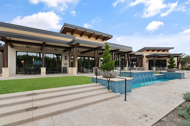 outdoor pool with ceiling fan and a patio area