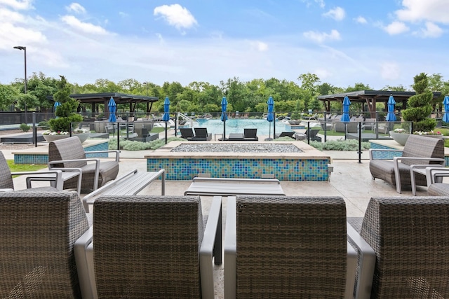 community pool with a patio and an outdoor living space