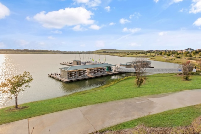 dock area featuring a water view and a yard