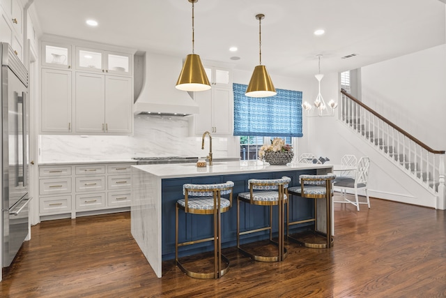 3428 Stanford Ave, University Park, TX 75225 - kitchen featuring premium range hood, tasteful backsplash, stainless steel built in refrigerator, a sink, and dark wood-style flooring