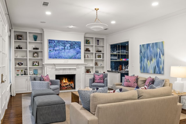 3428 Stanford Ave, University Park, TX 75225 - living room with ornamental molding, a high end fireplace, dark wood-style flooring, recessed lighting, and built in features