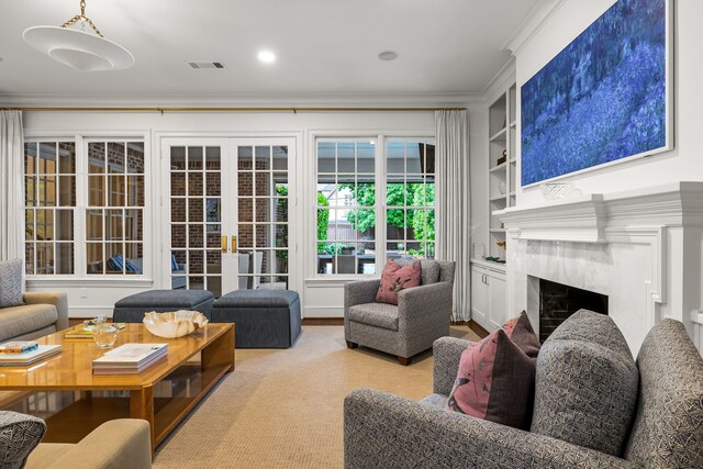 3428 Stanford Ave, University Park, TX 75225 - living area featuring crown molding, a fireplace, and built in shelves