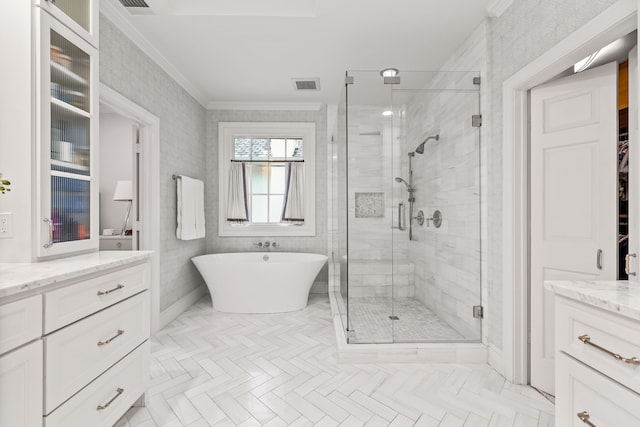3428 Stanford Ave, University Park, TX 75225 - full bathroom featuring a stall shower, vanity, crown molding, a freestanding bath, and a spacious closet