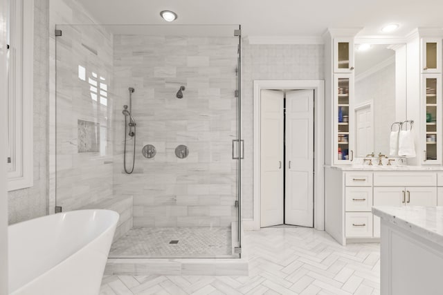 3428 Stanford Ave, University Park, TX 75225 - full bath with a shower stall, ornamental molding, vanity, a freestanding tub, and a spacious closet