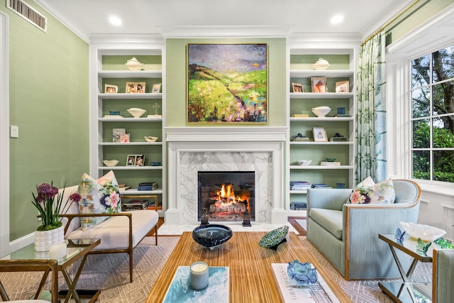 3428 Stanford Ave, University Park, TX 75225 - sitting room featuring ornamental molding, a high end fireplace, built in shelves, and wood finished floors