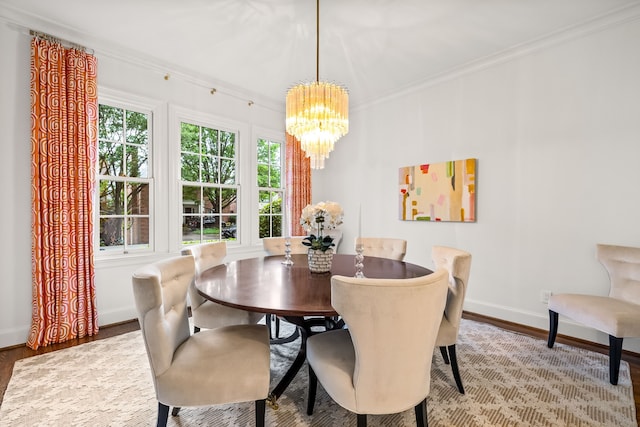 3428 Stanford Ave, University Park, TX 75225 - dining space featuring a chandelier, wood finished floors, baseboards, and crown molding