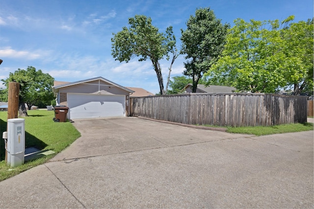view of property exterior with concrete driveway