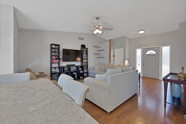 living room featuring wood finished floors and a ceiling fan
