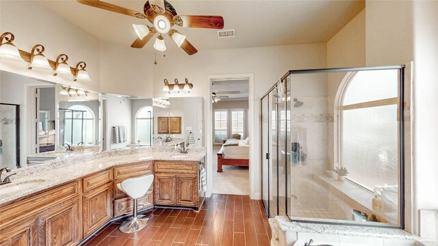 2705 Brunswick Cv, Trophy Club, TX 76262 - ensuite bathroom featuring ceiling fan, a shower stall, double vanity, and wood tiled floors