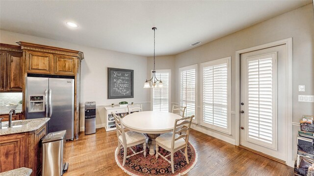 2705 Brunswick Cv, Trophy Club, TX 76262 - dining room with light wood finished floors, baseboards, and recessed lighting