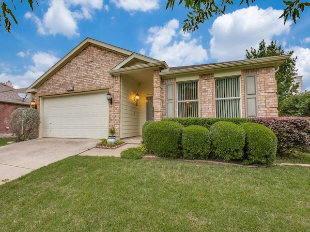 view of front of property with brick siding, a garage, driveway, and a front lawn