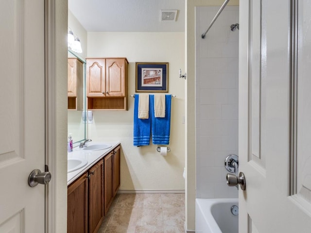 full bathroom with double vanity,  shower combination, tile patterned floors, and baseboards