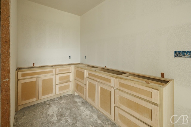 7507 Salerno Ct, Abilene, TX 79606 - kitchen featuring light brown cabinets and light colored carpet