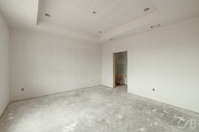7507 Salerno Ct, Abilene, TX 79606 - empty room with a tray ceiling and concrete flooring