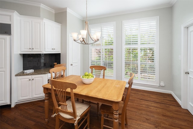 dining space with dark wood-type flooring, a chandelier, ornamental molding, and healthy amount of natural light