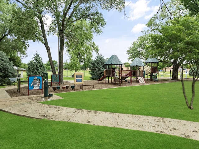 community jungle gym with a yard