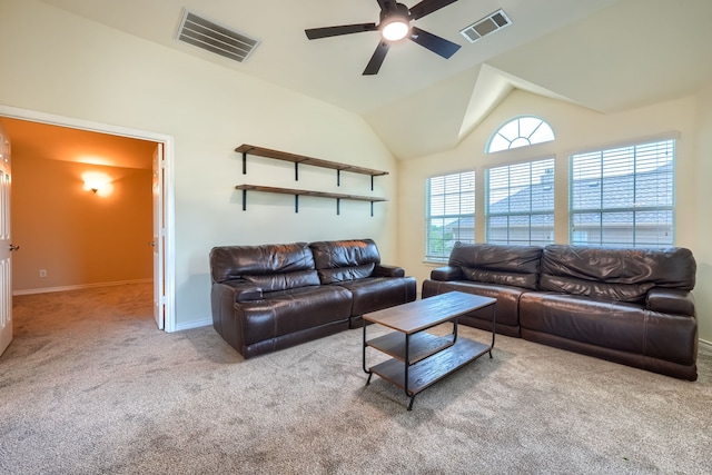 carpeted living area with a ceiling fan, baseboards, and vaulted ceiling