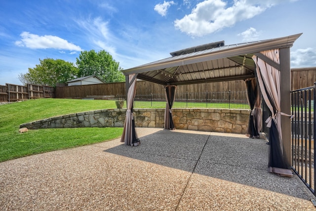 view of patio featuring a gazebo and a fenced backyard
