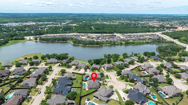view of property location with a large body of water and nearby suburban area