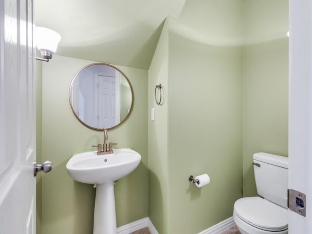 323 Emma Call Ct, Decatur, TX 76234 - bathroom featuring toilet and baseboards
