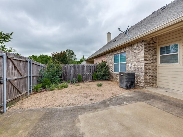 323 Emma Call Ct, Decatur, TX 76234 - fenced backyard with a patio area and central air condition unit