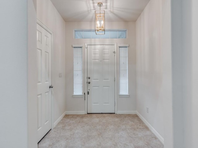 323 Emma Call Ct, Decatur, TX 76234 - entryway with baseboards, healthy amount of natural light, and light tile patterned floors