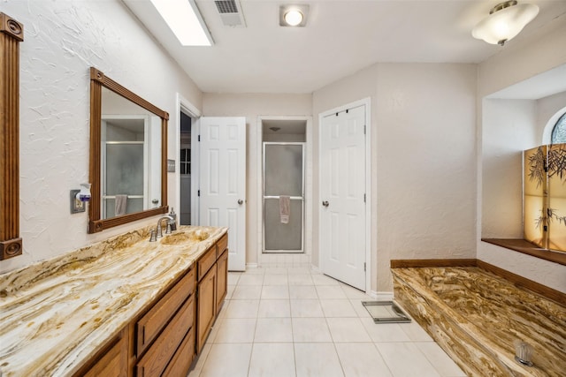 4204 Twilight Dr S, Benbrook, TX 76116 - bathroom featuring a stall shower, vanity, tile patterned floors, a textured wall, and baseboards