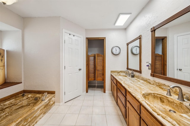 4204 Twilight Dr S, Benbrook, TX 76116 - bathroom with double vanity, tile patterned floors, a garden tub, and baseboards