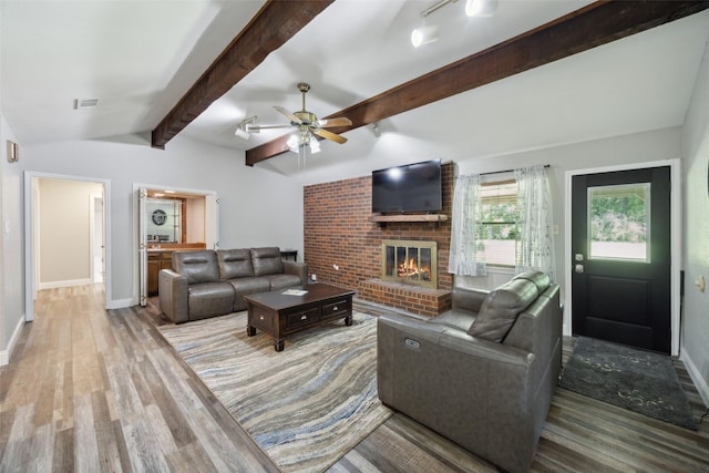 4204 Twilight Dr S, Benbrook, TX 76116 - living room with wood finished floors, a brick fireplace, baseboards, and a ceiling fan