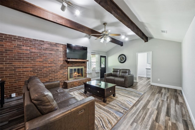 4204 Twilight Dr S, Benbrook, TX 76116 - living room with wood finished floors, a brick fireplace, baseboards, a ceiling fan, and brick wall