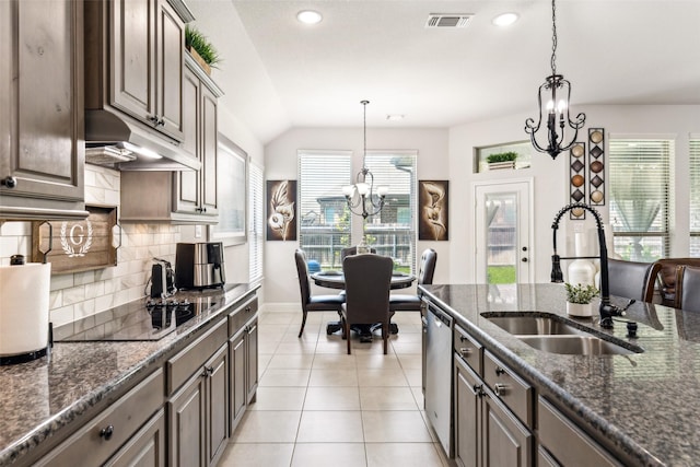 121 Quail Run Rd, Red Oak, TX 75154 - kitchen with a sink, stainless steel dishwasher, a chandelier, tasteful backsplash, and baseboards
