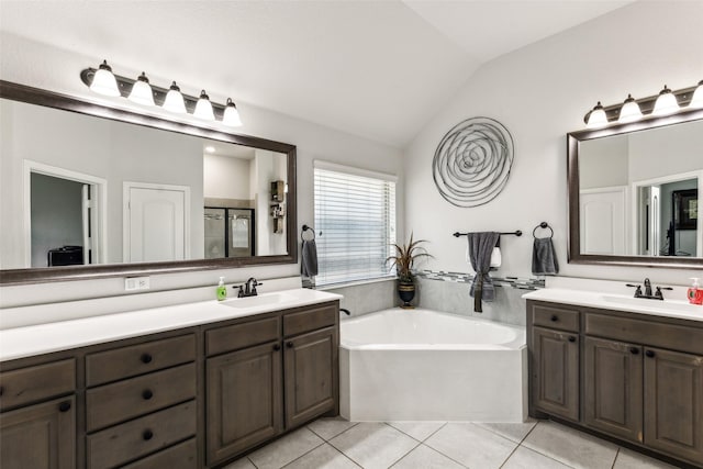 121 Quail Run Rd, Red Oak, TX 75154 - full bath featuring vaulted ceiling, tile patterned floors, a bath, vanity, and a shower stall