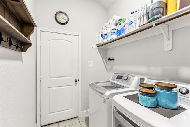 121 Quail Run Rd, Red Oak, TX 75154 - laundry area featuring washing machine and clothes dryer and light tile patterned floors