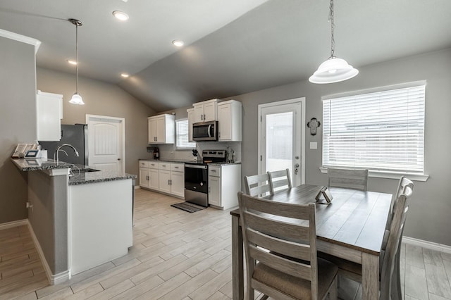 391 Paso Fino St, Waco, TX 76706 - dining area with light wood-style floors, baseboards, lofted ceiling, and recessed lighting