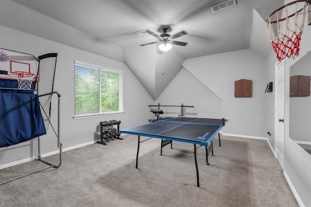 recreation room featuring carpet floors, a ceiling fan, vaulted ceiling, and baseboards
