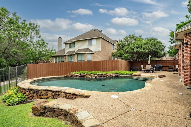 view of pool with fence and a patio