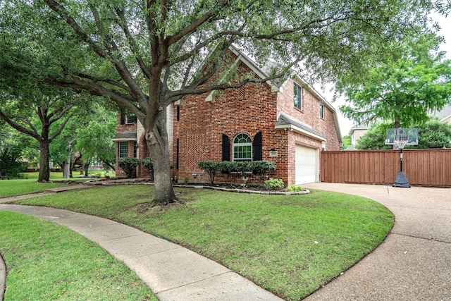 traditional-style home featuring driveway and brick siding