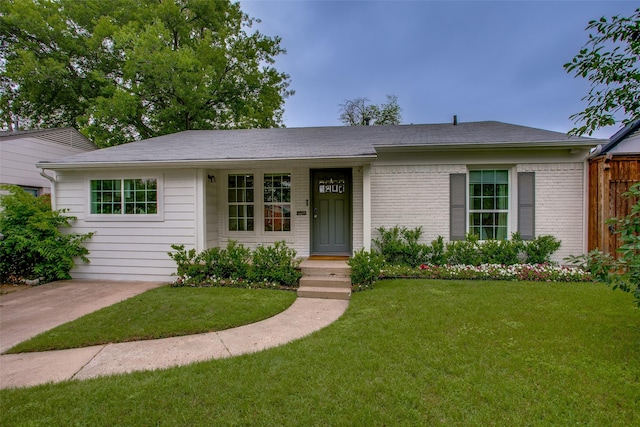 4719 Wateka Dr, Dallas, TX 75209 - ranch-style house with a front lawn, brick siding, and roof with shingles