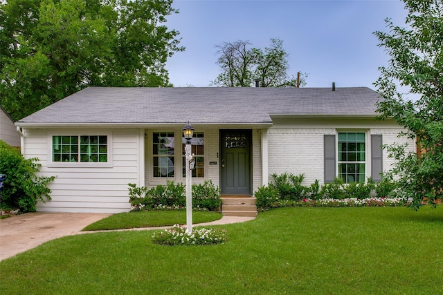 4719 Wateka Dr, Dallas, TX 75209 - single story home with a front yard, brick siding, and a shingled roof