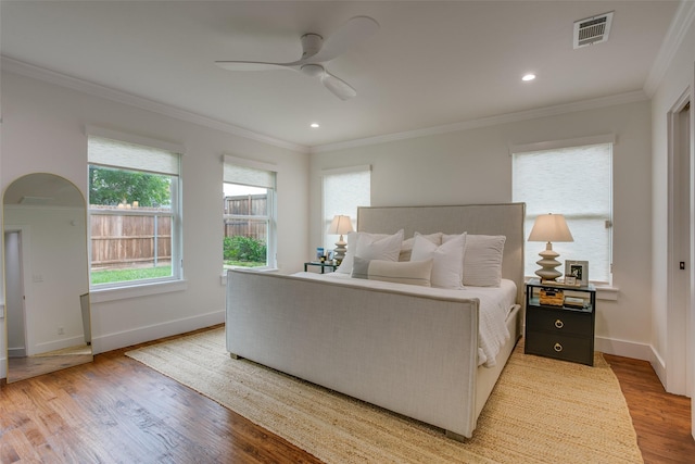 4719 Wateka Dr, Dallas, TX 75209 - bedroom featuring light wood-type flooring, crown molding, baseboards, recessed lighting, and ceiling fan