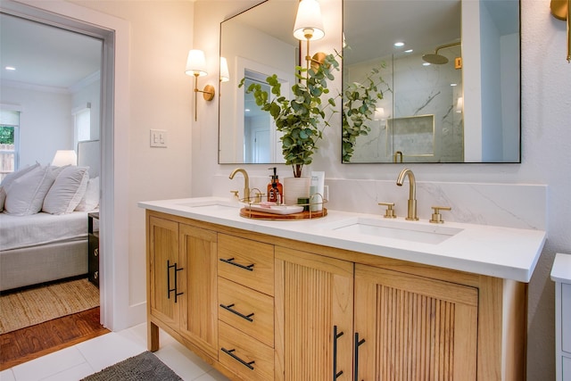 4719 Wateka Dr, Dallas, TX 75209 - full bathroom featuring ensuite bath, crown molding, a marble finish shower, tile patterned floors, and double vanity