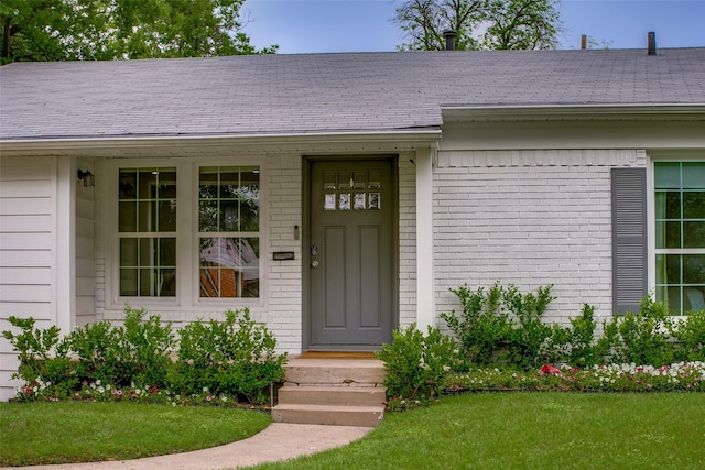 4719 Wateka Dr, Dallas, TX 75209 - entrance to property with brick siding, a yard, and roof with shingles