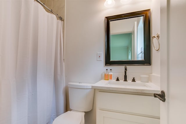 4719 Wateka Dr, Dallas, TX 75209 - bathroom with toilet, vanity, and a shower with curtain