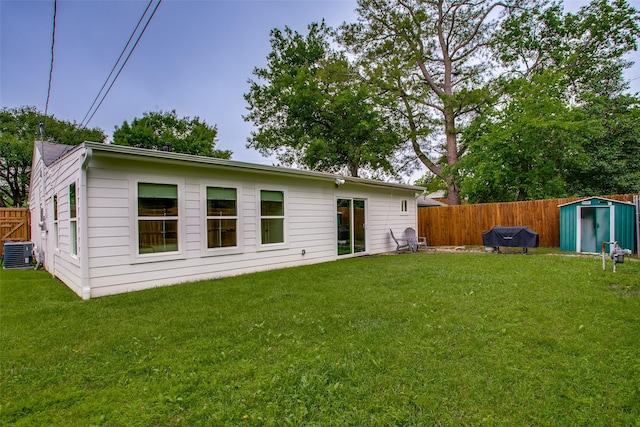 4719 Wateka Dr, Dallas, TX 75209 - rear view of house with central air condition unit, a shed, and an outbuilding