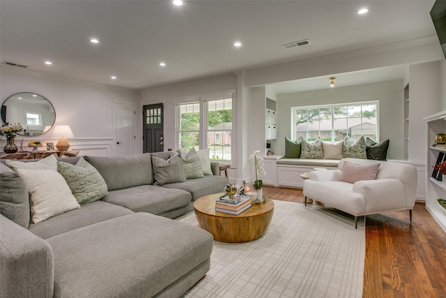 4719 Wateka Dr, Dallas, TX 75209 - living room featuring wood finished floors, recessed lighting, ornamental molding, and wainscoting